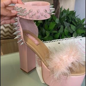 Dolls Kill Sugarbaby brand pink platforms with feathers and studs